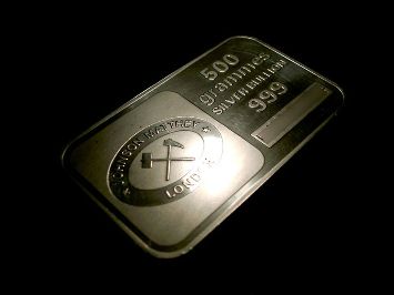 Featured is a precious metal themed-photo of a 500g silver bullion bar produced by Johnson Matthey of London.